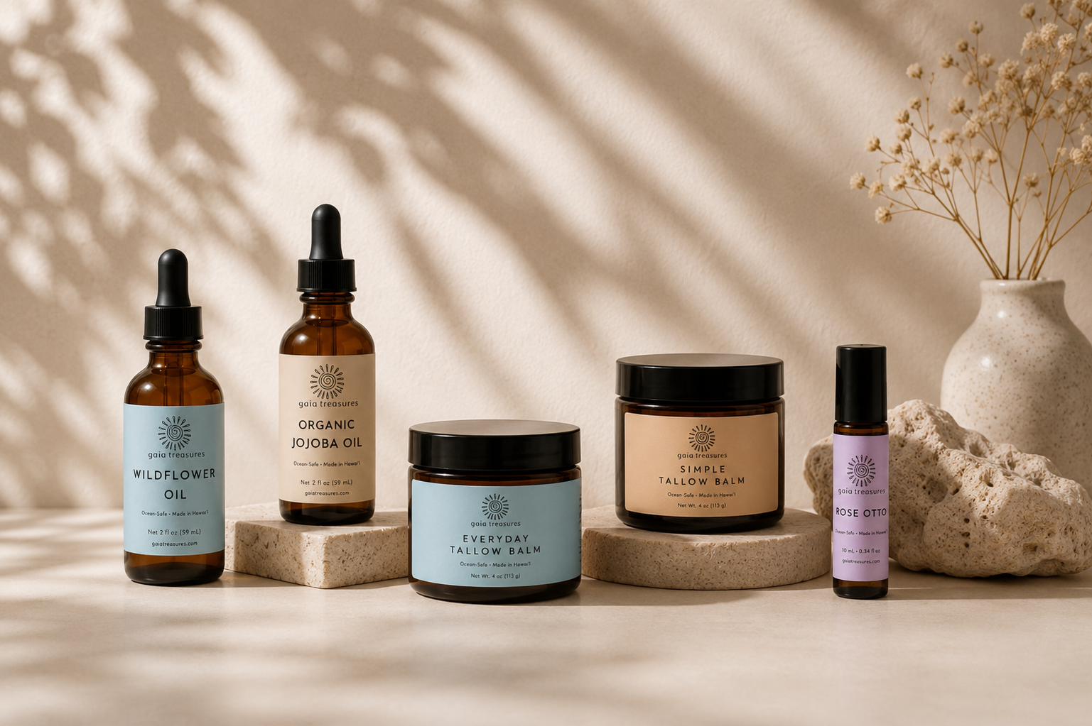 Gaia Treasures amber glass skincare products on a milky white surface